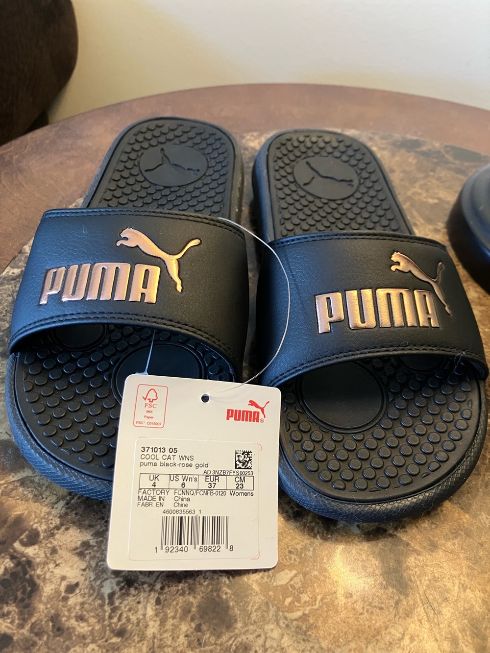 Puma Black Slides with Metallic Rose Accents